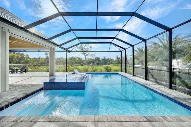 view of pool with a lanai and a patio area