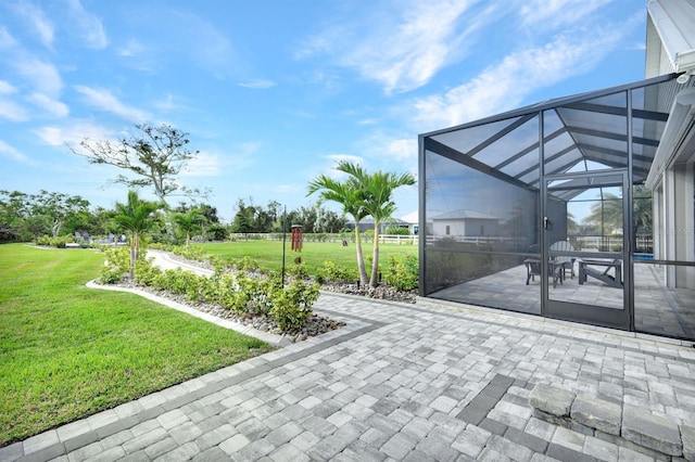 view of patio featuring glass enclosure