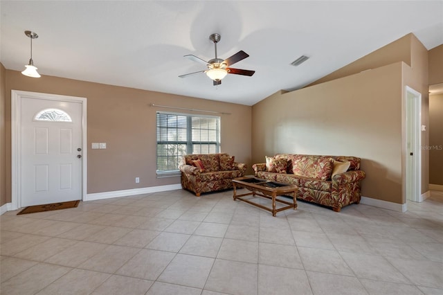 living room with vaulted ceiling, ceiling fan, and light tile patterned floors