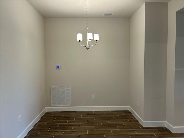 2648 Averland Loop, North Port, FL 34287 - unfurnished room with wood finish floors and a chandelier