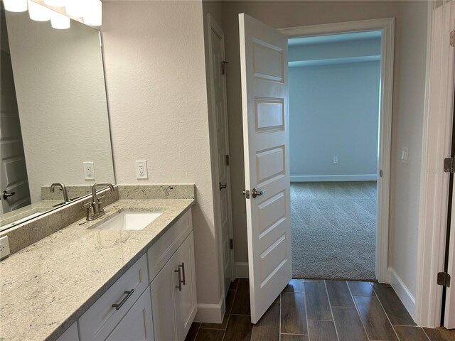 2648 Averland Loop, North Port, FL 34287 - bathroom with vanity and wood tiled floors
