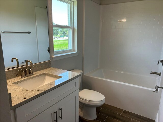 2648 Averland Loop, North Port, FL 34287 - full bathroom with vanity, wood finish floors, and shower / tub combination