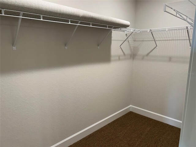 2648 Averland Loop, North Port, FL 34287 - walk in closet featuring dark colored carpet