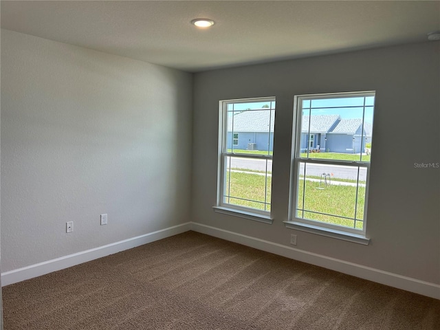 2648 Averland Loop, North Port, FL 34287 - unfurnished room featuring dark carpet and baseboards