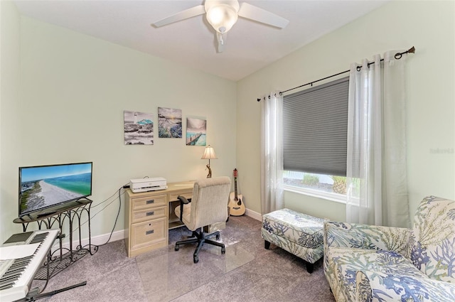 carpeted office featuring ceiling fan