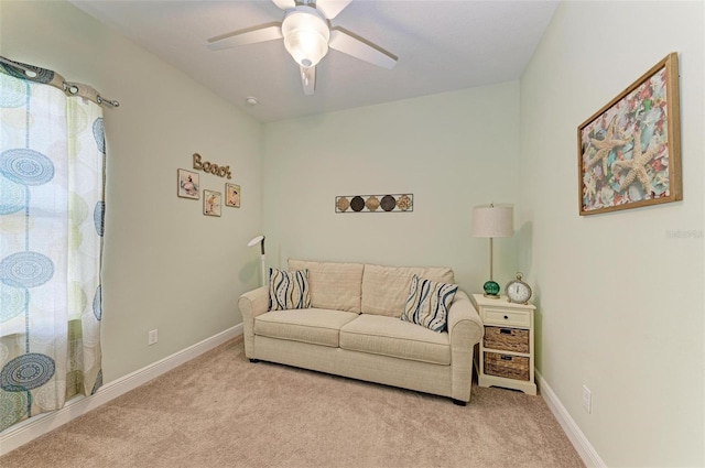 living room with light carpet and ceiling fan