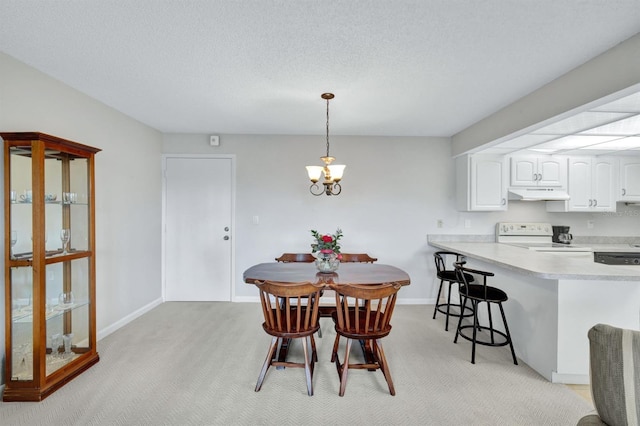 carpeted dining area with a textured ceiling and a chandelier