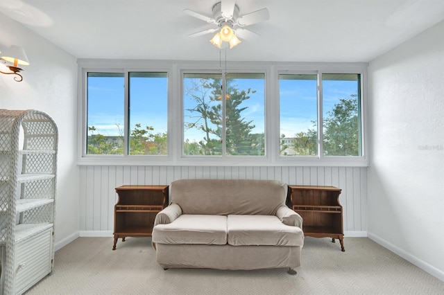 sunroom / solarium featuring ceiling fan and plenty of natural light