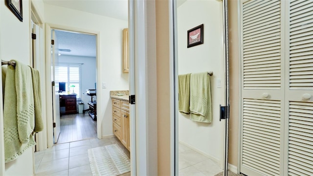 bathroom featuring vanity, tile patterned flooring, and a textured ceiling