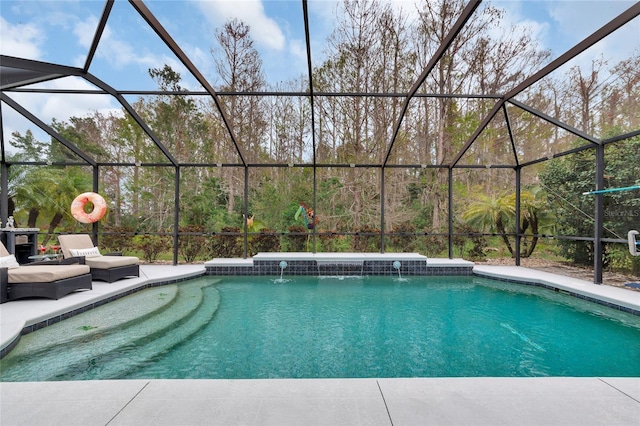 view of pool with pool water feature and a lanai