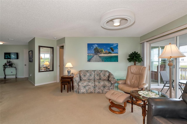 living room with a textured ceiling and carpet flooring