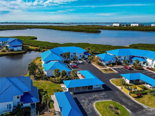 birds eye view of property featuring a water view