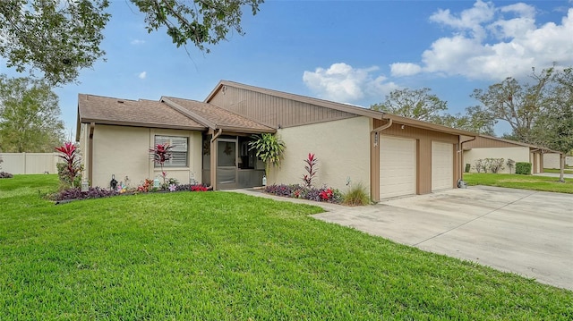 single story home featuring a garage and a front yard