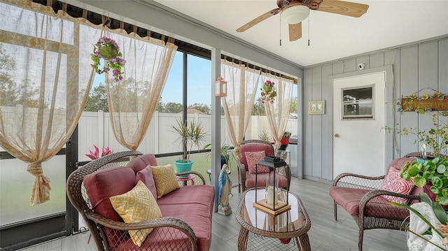 sunroom / solarium with ceiling fan