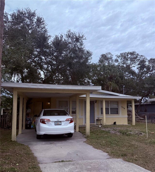 view of front facade with a carport