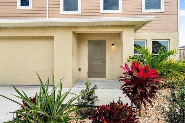 doorway to property featuring a garage