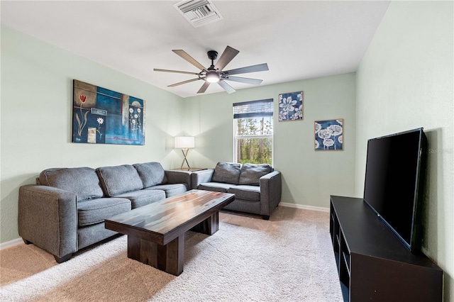 living room with light colored carpet and ceiling fan