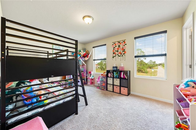 carpeted bedroom with a textured ceiling