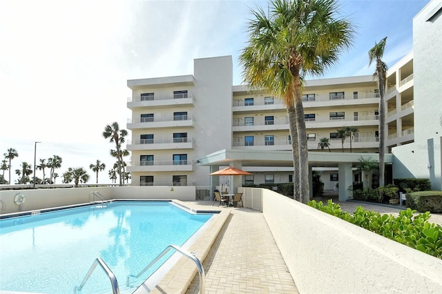 community pool featuring a patio area