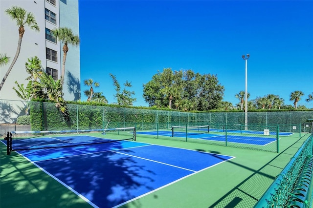 view of sport court with fence