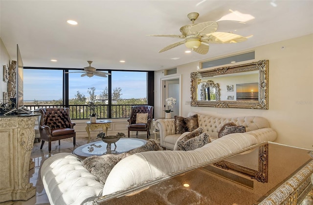 living room with a ceiling fan and recessed lighting