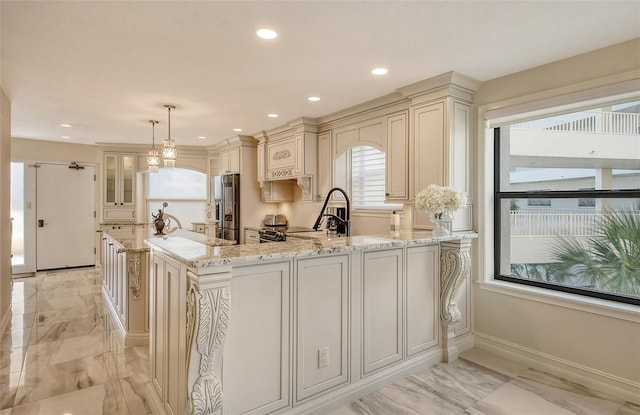 kitchen with marble finish floor, cream cabinetry, light stone countertops, and stainless steel fridge with ice dispenser