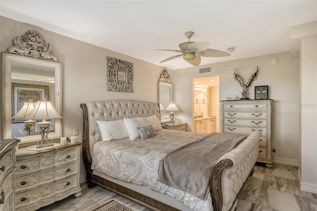 bedroom with baseboards, visible vents, ensuite bath, ceiling fan, and marble finish floor