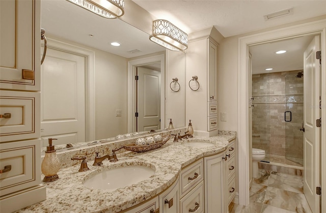 full bath with double vanity, a sink, visible vents, and a shower stall