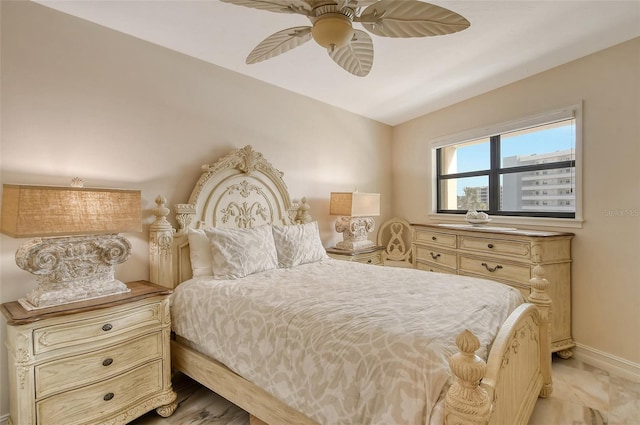 bedroom featuring baseboards and a ceiling fan