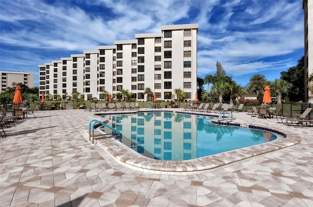 view of swimming pool featuring a patio area