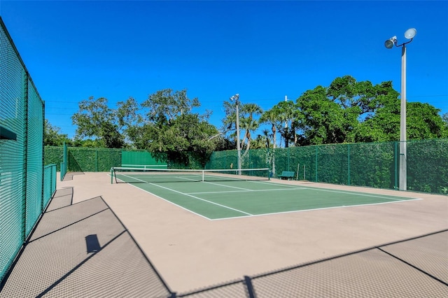 view of sport court with community basketball court and fence