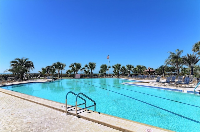 community pool featuring a patio area