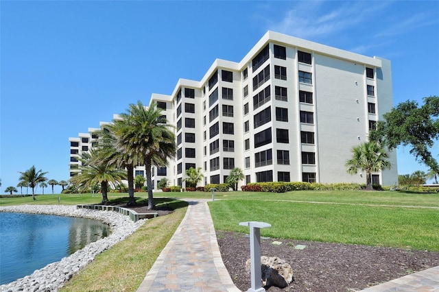 view of building exterior with a water view