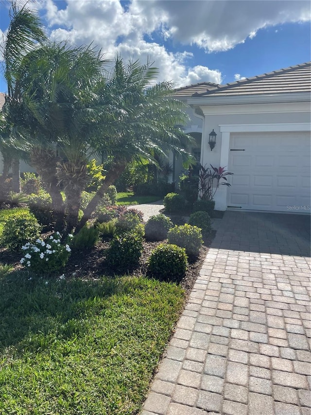 view of side of home with a garage