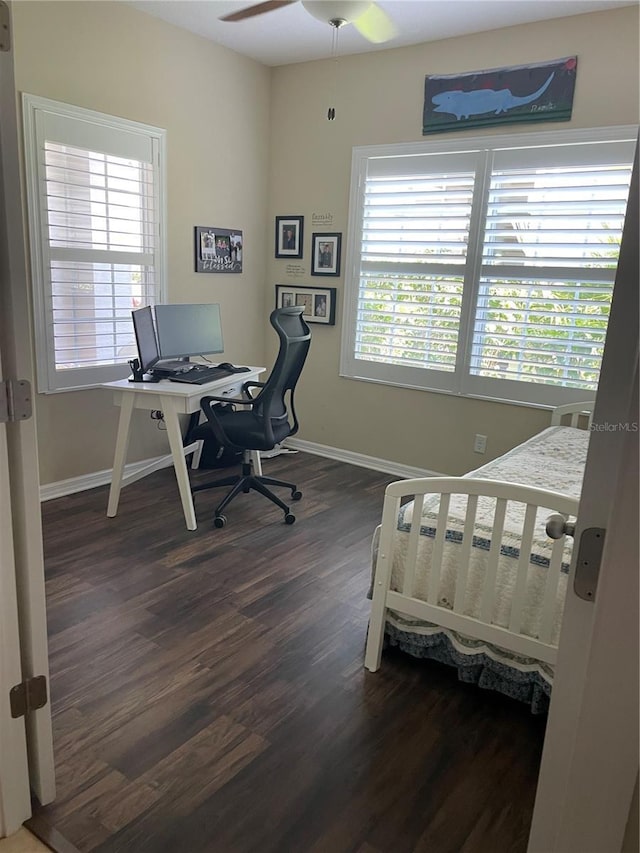 bedroom with ceiling fan and dark hardwood / wood-style flooring