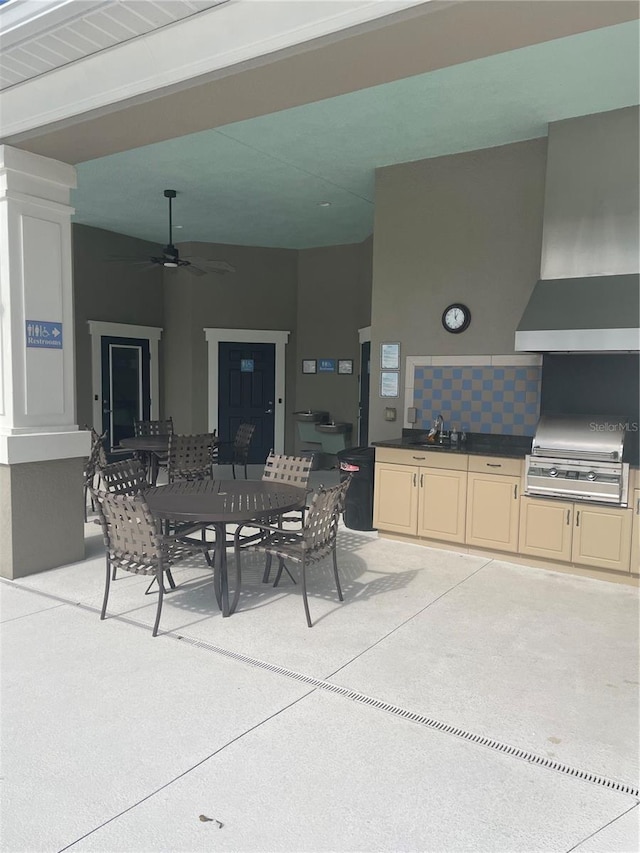 view of patio featuring exterior kitchen, sink, and area for grilling