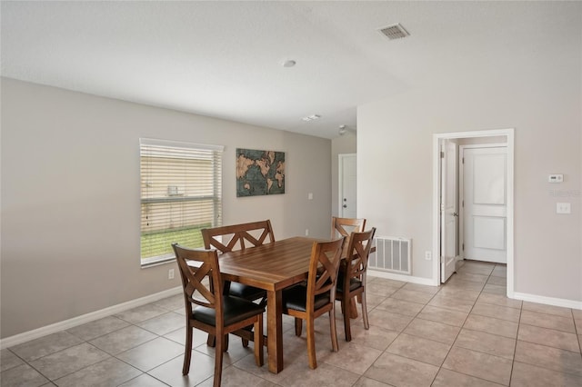 dining area featuring light tile patterned floors