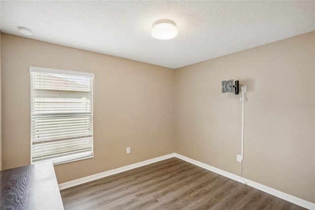 unfurnished room featuring hardwood / wood-style floors