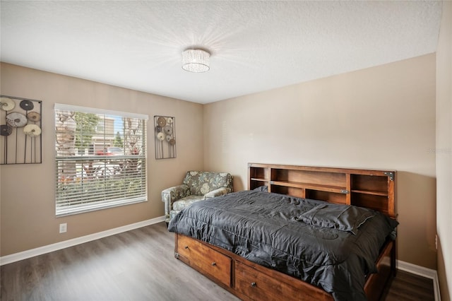 bedroom featuring hardwood / wood-style flooring