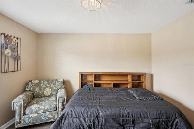 bedroom featuring a textured ceiling