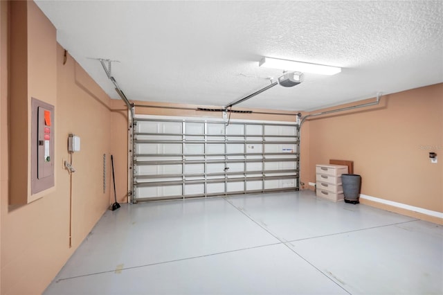 garage with a garage door opener and electric panel