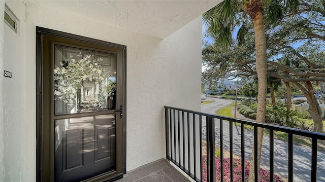 doorway to property with a balcony