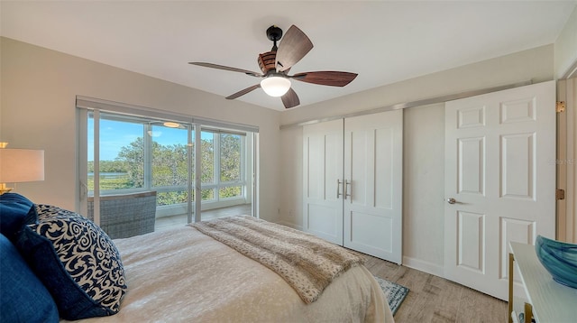 bedroom with ceiling fan, a closet, and light hardwood / wood-style flooring