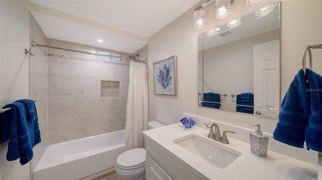 full bathroom featuring vanity, shower / bath combination with curtain, and toilet