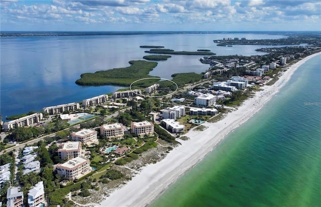 aerial view with a view of the beach and a water view