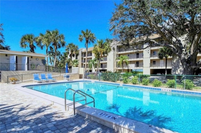 view of swimming pool featuring a patio area