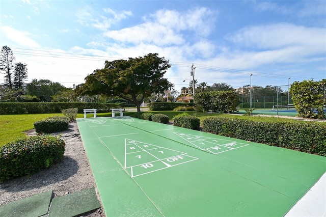 surrounding community featuring tennis court