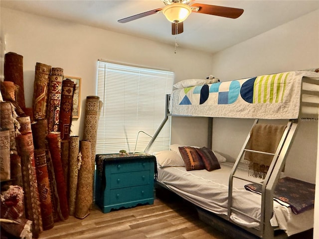 bedroom featuring ceiling fan and hardwood / wood-style flooring