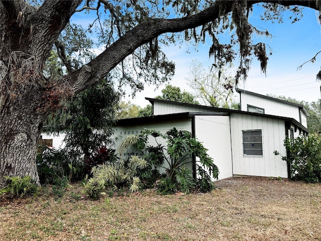 view of property exterior featuring a lawn