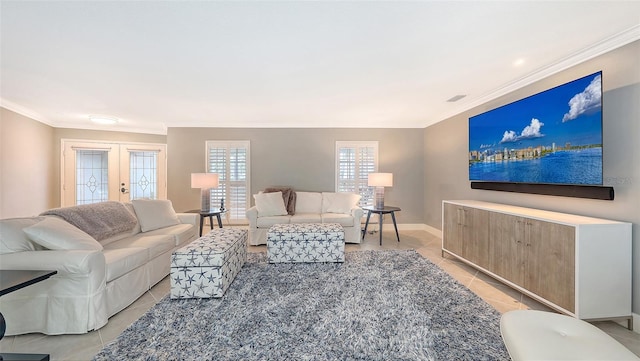 tiled living room with crown molding and french doors